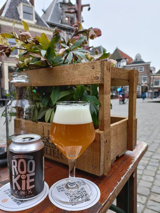 Glass of beer on a table at the main square in my city