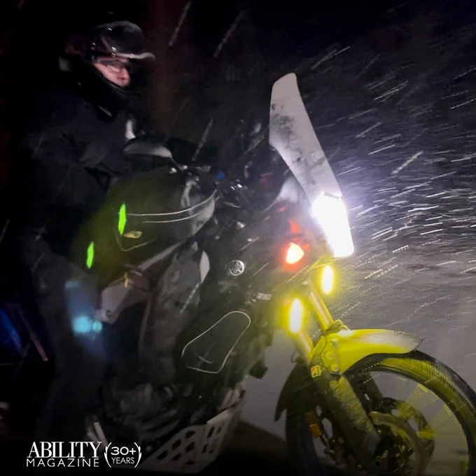 Paul on his motorcycle riding at night in the rain.