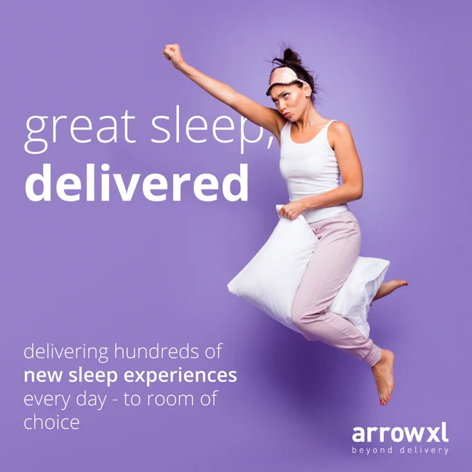 Image: a woman wearing pyjamas and a night mask riding a pillow and flinging her arm out like a Superwoman - Text: great sleep, delivered. delivering hundreads of new sleep experiences every day - to room of choice