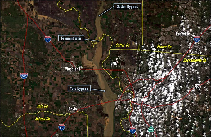 Satellite image of flooding along the Lower Sacramento River from Wednesday, March 15, 2023, showing the Sutter Bypass and Yolo Bypass filled with water as a flood control measure.