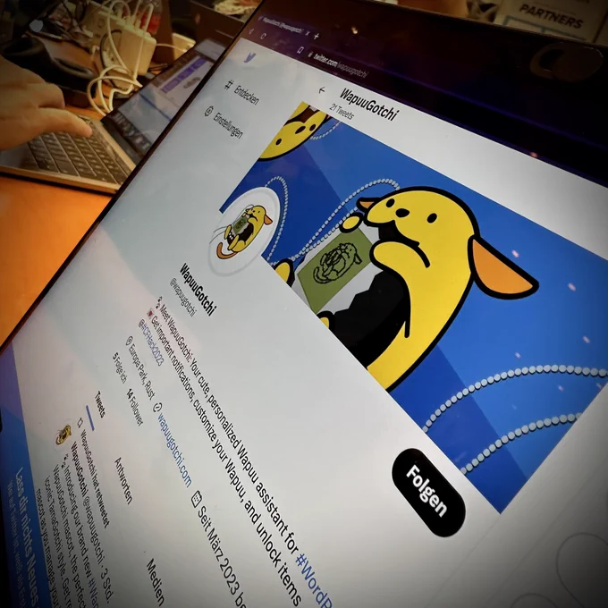 A MacBook showing Twitter in a browser