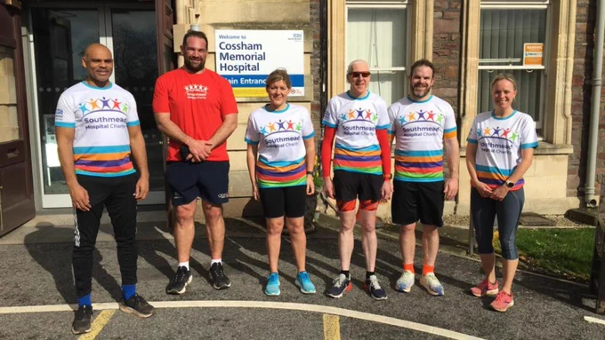 Six runners are pictured outside of Cossham Memorial Hospital, Bristol, all wearing Southmead Hospital Charity t-shirts. Left to right: Mayor Marvin Rees, Olly Kohn, Anita Earley, David Evans, Rob Higgitt, and Bonny Hetherington. 
