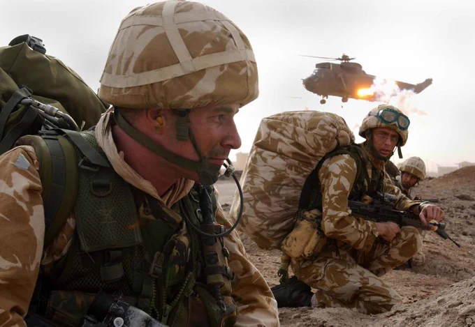 A Sea King fires flares after dropping 40 Commando ashore at Al Faw