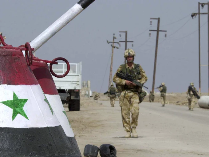 42 Commando patrol a road outside Umm Qasr