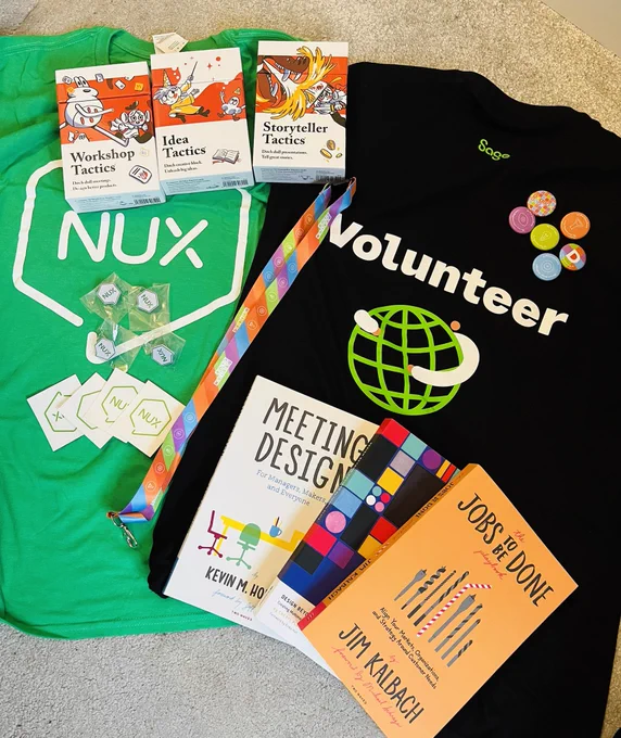 Design club and NUX materials ready for our events this week. Photo includes images of resources and giveaways from t-shirts, badges, stickers, books and Pip Decks workshop cards.