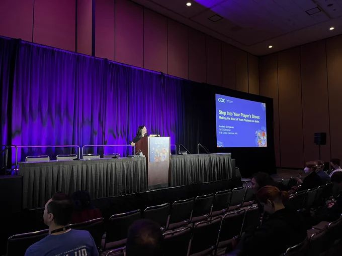 Photo of Andreia Gonçalves on stage at GDC