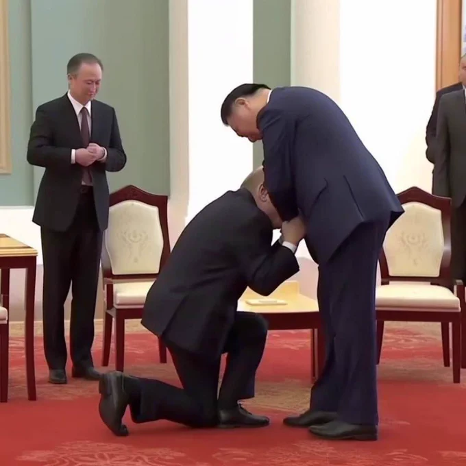 Vladimir Putin and Xi Jinping are seen in a government building. Putin is kneeling down directly in front of Xi, holding his hand and covering his face with Xi's suit jacket.