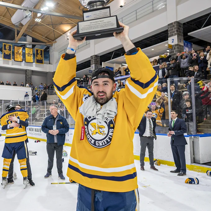 David Melaragni hoists the Jack Riley Trophy on the ice at LECOM Harborcenter on March 18