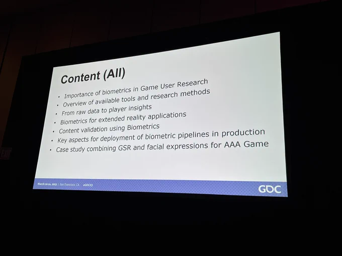 Photo of a slide listing the content:
- Importance of biometrics in game user research 
- Overview of available tools and research methods
- From raw data to player insights
- Biometrics for extended reality applications
- Content validation using biometrics
- Key aspects for deployment of biometrics pipeline in production
- Case study combining GSR and facial expressions for AAA game