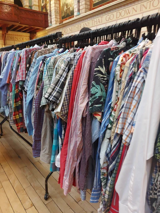 Lots of shirts on rails