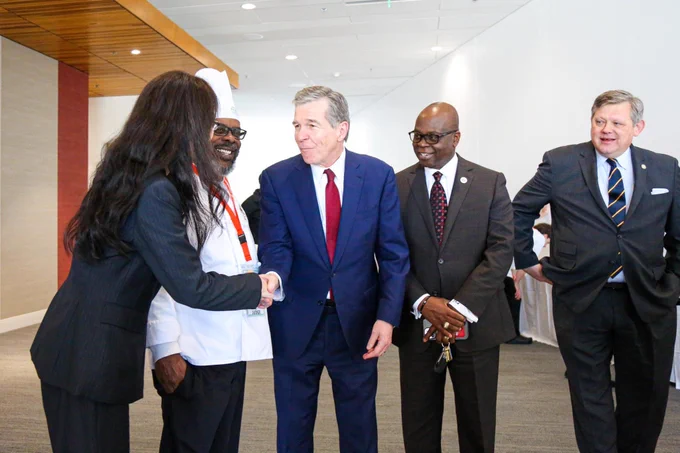 Gov. Cooper meets with officials at the NC ProStart Invitational event