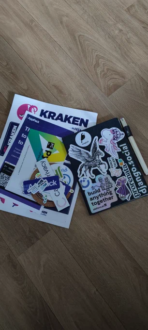Stickers of python web conference and my notebook with multiple stickers