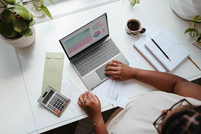 person working at a desk and computer