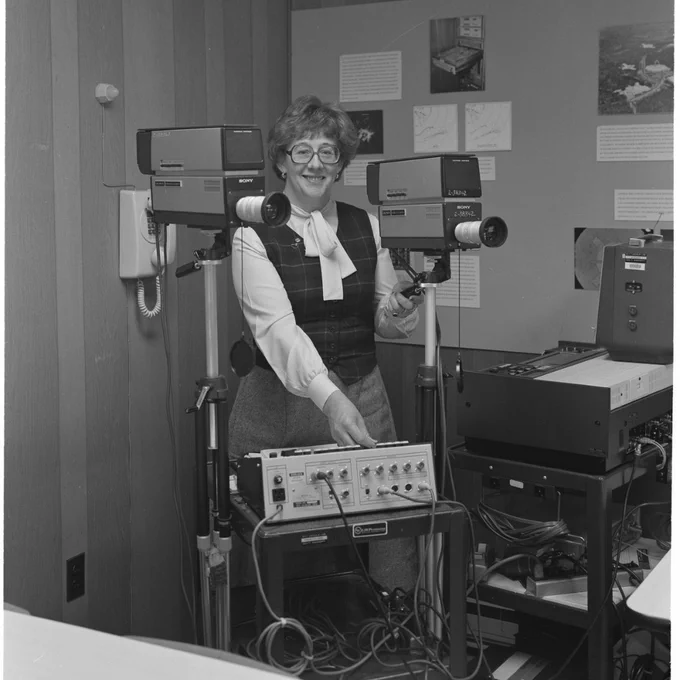 Black and white image of Evelyn Murray with machine equipment.
