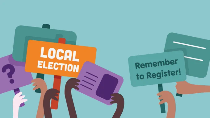 A graphic of cartoon hands holding up picket signs that say:
Local Election
Remember to Register!