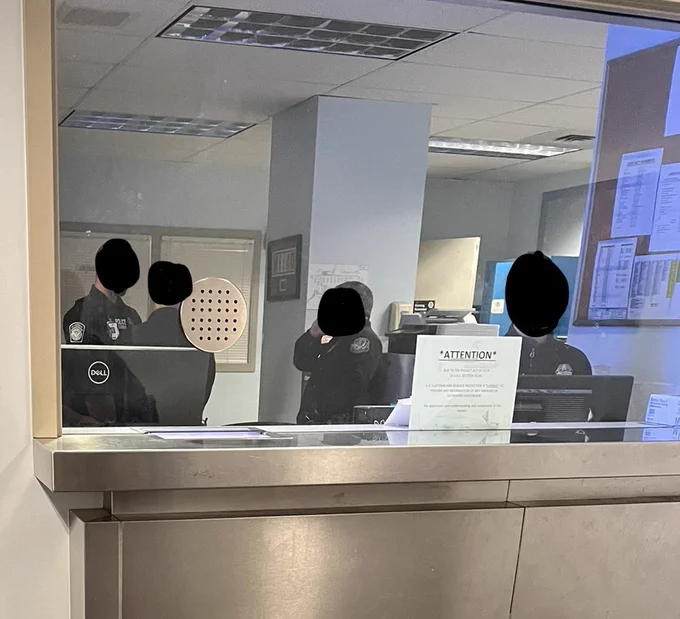 Photo of border control officers with faces obscured