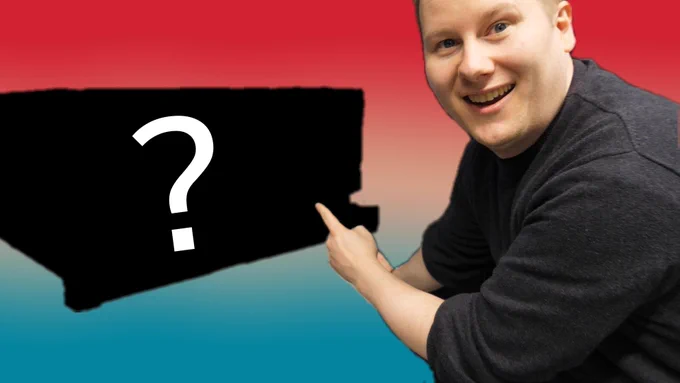 Pointing at a blacked out box with a question mark on it