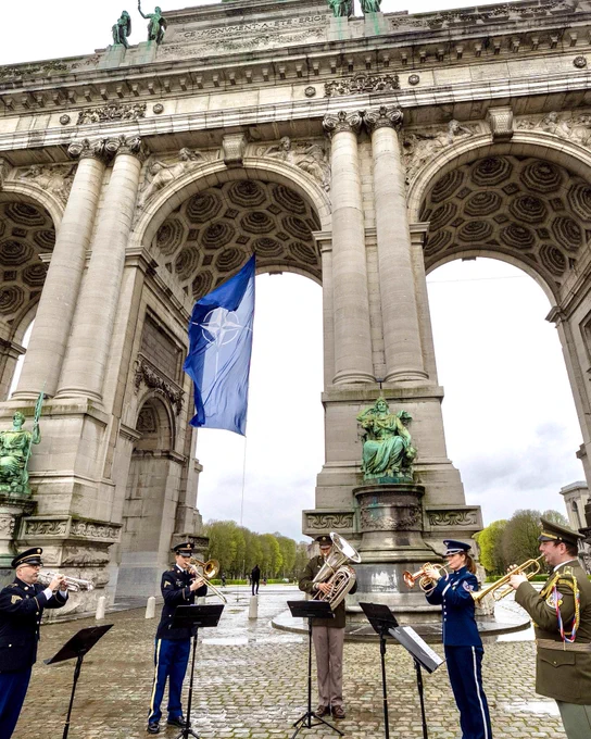 A military band play whilst the NATO Flag is raised at the Arches of the Cinquantenairein Brussels for the occasion of NATO Day. Photo taken 31 March 2023