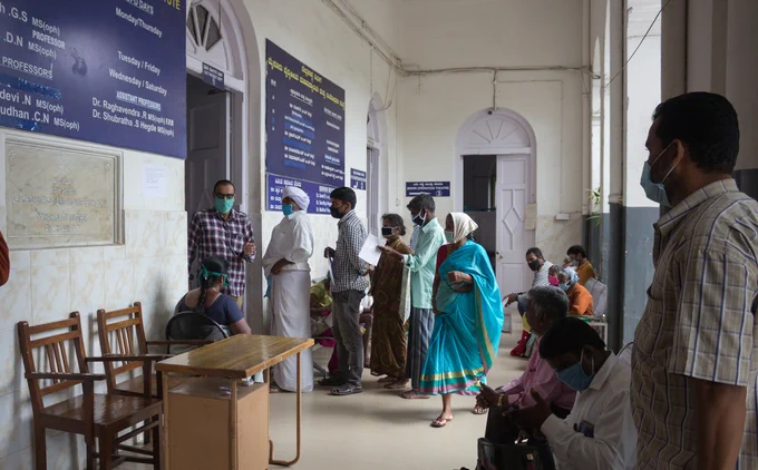 Patients lined up in the hospital ward.