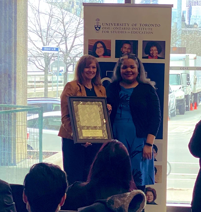 Heather Friesen  accepts her Award for Excellence in Continuing & Professional Learning from Dr. Erica Walker, Dean of OISE at the April 4 Faculty & Staff Excellence awards ceremony.