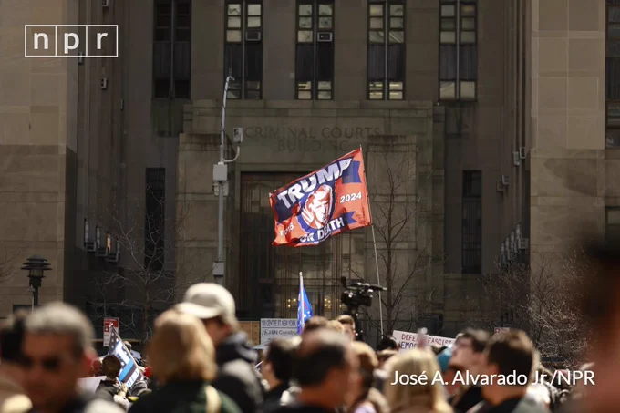 The entrance of Manhattan Criminal Courts Building fills with commotion from supporters of the former president as Donald J. Trump makes his way to his scheduled surrender at the Manhattan Criminal Courts Building in Manhattan, New York City.
José A. Alvarado Jr. for NPR