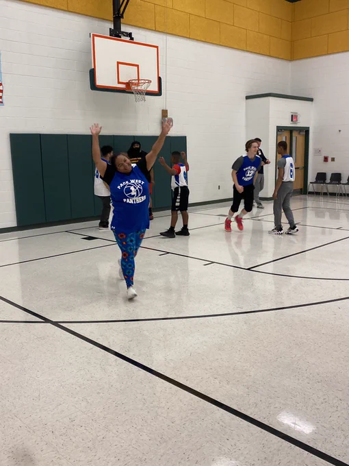 Ms. Shanna celebrating her points on the board.