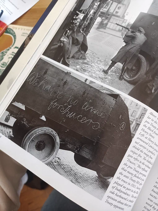 Photograph from The Green Divide, showing a vehicle with We have no time for truces written on it