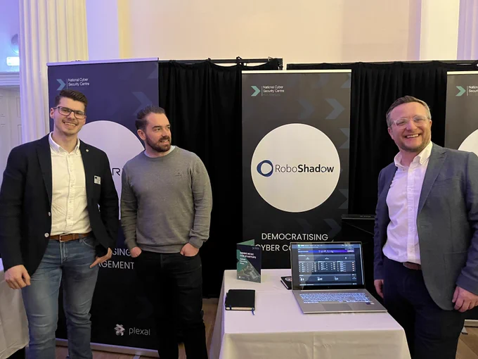 Three people from the #NCSCForStartups programme & alumni standing together at @CyNamHub’s ecosystem event yesterday. 