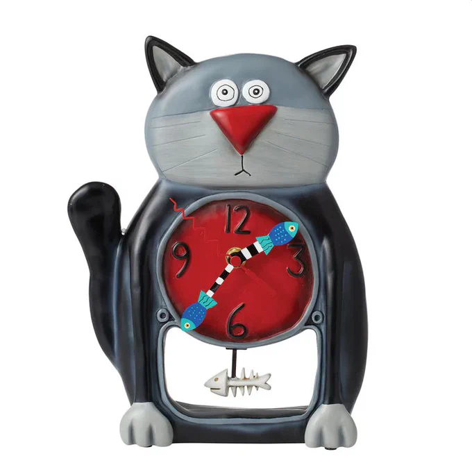 Pendulum clock in the shape of a comical black-and-grey cat. The clock face is red, with two blue fishes forming the hands of the clock, and a fish skeleton as the pendulum.