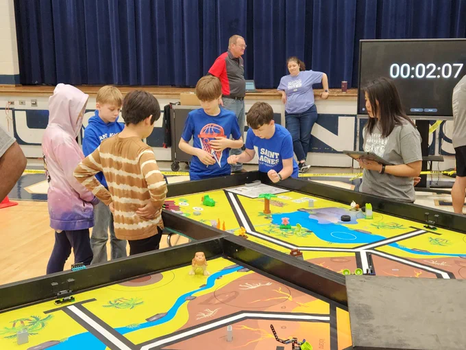 Jackie Honghern judging students competing in RCX. 

Lisa Revel collaborating with the RCX creator,  Doug Geiman.