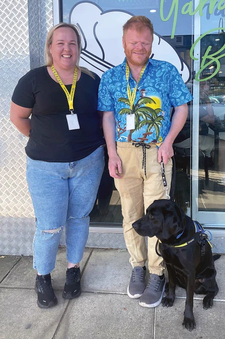 Phillip with support worker Kristie Wilkinson and Seeing Eye Dog, Sally