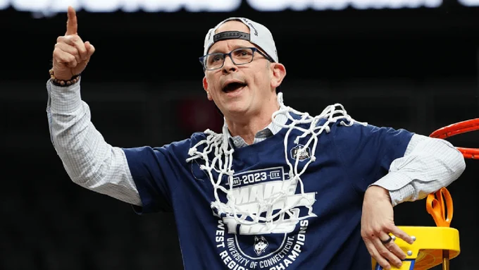 Dan Hurley celebrates his first trip to the Final Four by cutting down the nets after beating Gonazaga in the West Regional Finals.