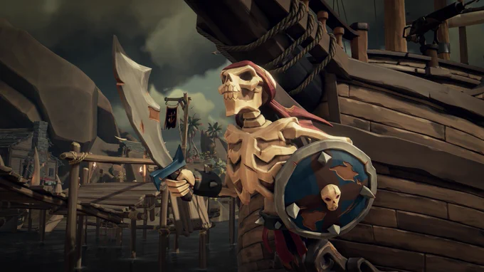 A close up shot of a ship's figurehead. The figurehead is a menacing skeleton, wielding a huge sword in its left hand and a shield in its right. The skull of the skeleton wears a red bandana.