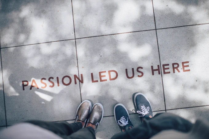 Photo by Ian Schneider on Unsplash of people standing on pavement