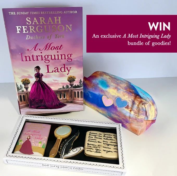 A copy of A Most Intriguing Lady, a wash bag, and biscuits. 