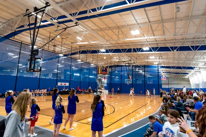 cheerleaders and fans at a basketball game