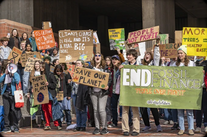 Youth climate protestors pose for a picture in front of Boston City Hall during March's global climate strike