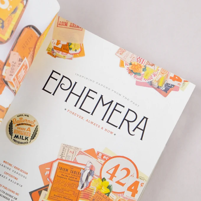 Ephemera book open to the title page which is typeset in Montecatini Pro. The spread is filled with orange ephemera.