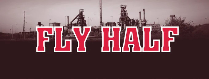 Red lettering (the type you get on the back of a rugby jersey) spells out FLY HALF on top of a moody image of a Steelworks in South Wales. 