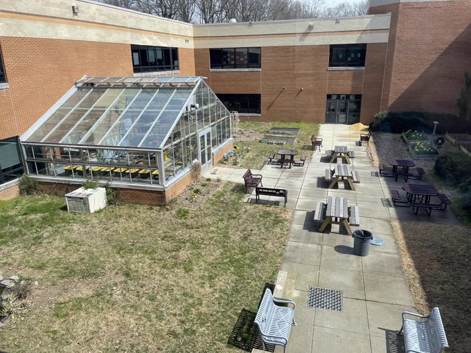 Photo of a greenhouse and benches at Broadneck High School.