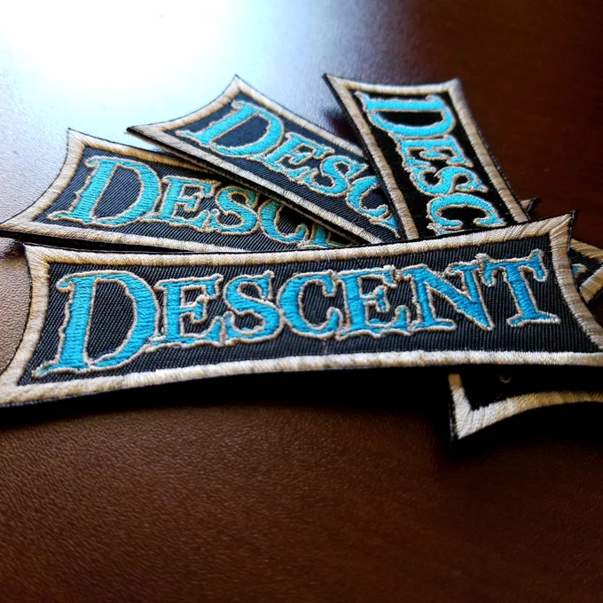 Embroidered patches for the board game descent.