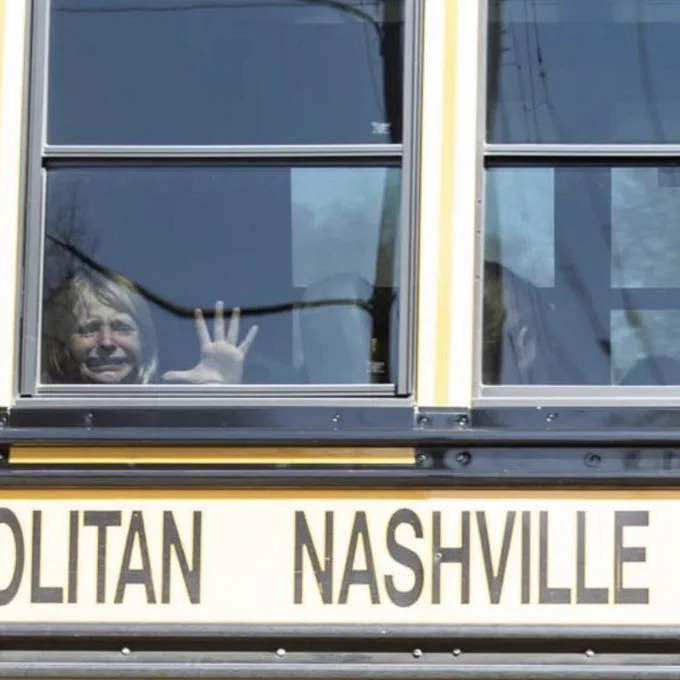 A child crying on a school bus