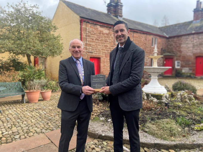 Martin Railton receiving the Inspiring Eden Award from Cllr Douglas Banks, Chair of Eden District Council