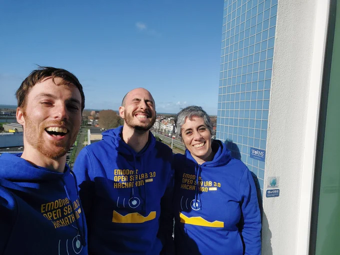 three opensealab hackathon coaches taking a happy selfie with seaview