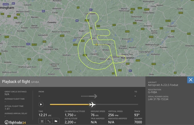 A flight path in the shape of the international symbol for a wheel chair user.