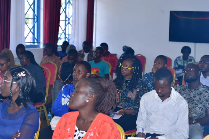 A photo of the muungano wa wanavijiji team being taken through a training workshop on vulnerability mapping.
