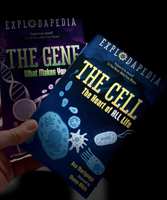 hand holding new books in Explodapedia series: The Cell and The Gene
