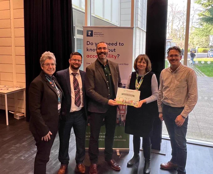 AccessAble handing an Accessibility plaque over to University of Nottingham. Present in the photo from left to right are Amanda Petingill, Dean Eales, David Livermore, Katherine Linehan and James Hale
