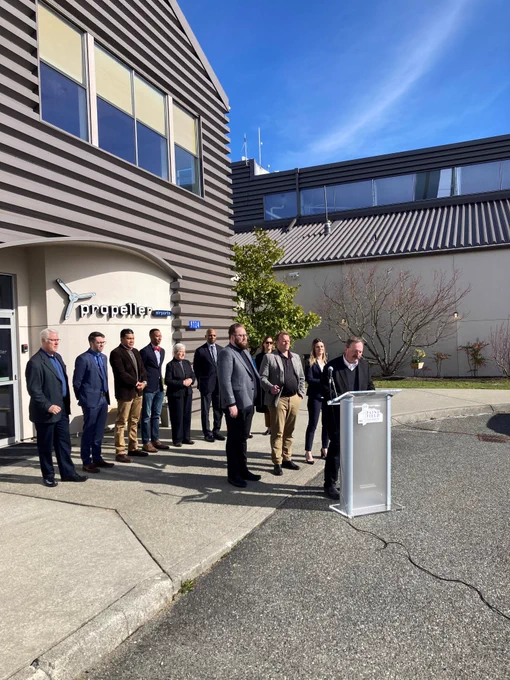 Snohomish County Executive Dave Somers standing at a press conference delivering remarks in front of Propeller Aero Services. 