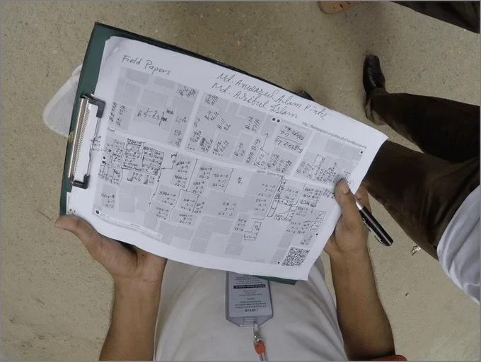 A Field Papers map on a clipboard. Photo from the Missing Maps Project.